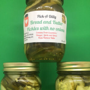 Three jars of pickles on a green background